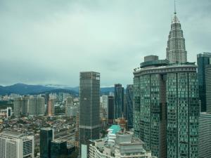 an aerial view of a city with a tall skyscraper at Vortex Apartments Kuala Lumpur in Kuala Lumpur +12 photos