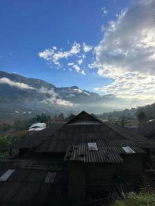 a roof of a building with mountains in the background at Eco green Homestay in Sa Pa