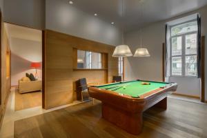 a living room with a pool table in it at Gran Hotel – Balneario de Panticosa in Panticosa