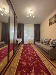 a bedroom with a bed and a mirror at Моршинский in Dobrovelychkivka +70 photos