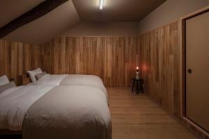 Postel nebo postele na pokoji v ubytování 時富 Tokitoyo 岸和田城 旧紀州街道沿いの古民家