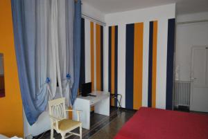 Postel nebo postele na pokoji v ubytování Albergo La Vela