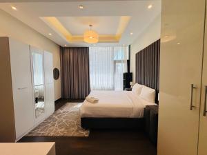 a hotel room with a bed and a window at New Memories Start In This New Home in Manama +64 photos