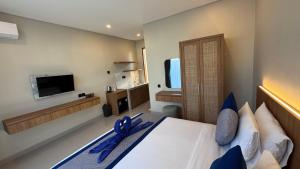 Televisyen dan/atau pusat hiburan di Tutur Bali Guest House