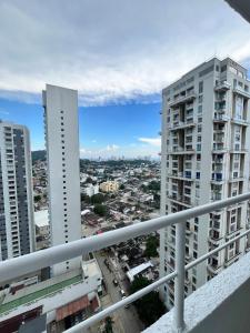 a view of a city from the balcony of a building at New Sea View Torre 811 in Cartagena de Indias