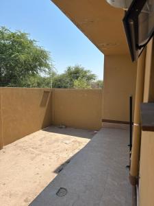 a view from the outside of a house with a wall at Villa Ndahafa in Ongwediva +2 photos