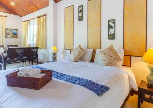 Postel nebo postele na pokoji v ubytování The Green Oasis Resort + 131 fotografií