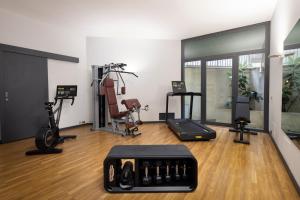 a gym with treadmills and exercise equipment in a room at Regina Elena Dependance in Santa Margherita Ligure