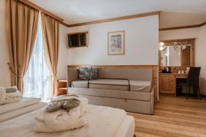 Postel nebo postele na pokoji v ubytování Hotel Rosa Degli Angeli + 44 fotografií