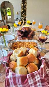 a table topped with a table with a turkey and bread at Chateau Mariposa in Spring Hill