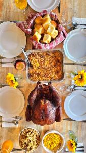 a table with a turkey and other food on it at Chateau Mariposa in Spring Hill