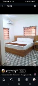 a screenshot of a bedroom with a large bed at Jackson's Court and Apartment in Abuja +4 photos