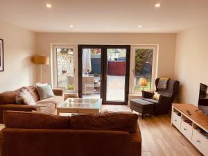a living room with a couch and a table at Cashel town house 4 bed in Cashel