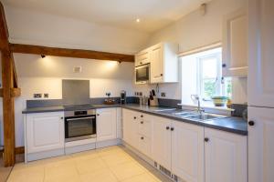 Kuchyň nebo kuchyňský kout v ubytování Stockmans Cottage + 16 fotografií