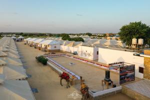 an overhead view of a group of buildings with horses and tents at NK Desert Camp Jaisalmer in Sām
