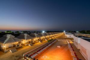 an overhead view of a row of tents at night at NK Desert Camp Jaisalmer in Sām
