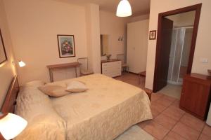 Postel nebo postele na pokoji v ubytování B&B Il Borgodmd