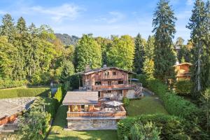an aerial view of a house in the woods at Chalet Ysalpe - Vue montagne hammam sauna jacuzzi et salle cinéma in Megève