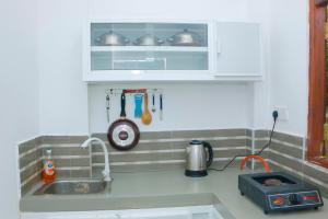 Η κουζίνα ή μικρή κουζίνα στο Nature Paradise Midigama