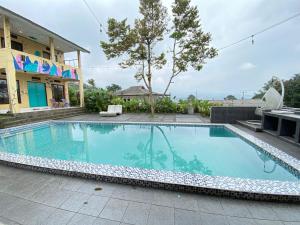 Bazén v ubytování villa puncak ressort nebo v jeho okolí