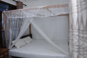 Ένα ή περισσότερα κρεβάτια σε δωμάτιο στο Nature Paradise Midigama