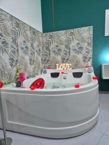 a hot tub in the middle of a room at House Mari in Catania +19 photos