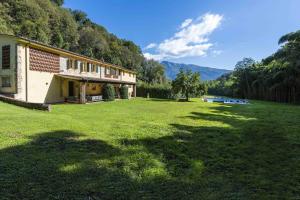 a building in a field with a large yard at Villa Bianca by MMega in Santa Lucia +37 photos