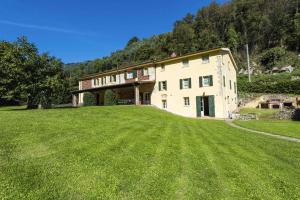 a large house with a large lawn in front of it at Villa Bianca by MMega in Santa Lucia