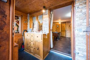 a bathroom with a sink and a mirror at Bas De Chalet Lout'Chi Valfréjus in Valfréjus +15 photos