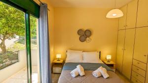 Postel nebo postele na pokoji v ubytování Villa Iris + 31 fotografií