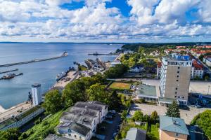 an aerial view of a city and a body of water at Rügen-Hotel in Sassnitz