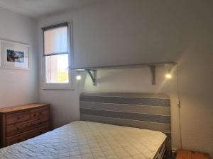 a bedroom with a bunk bed and a window at T2 cabine - CAP D'AGDE CT300-124 in Cap d'Agde