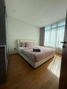 Ένα ή περισσότερα κρεβάτια σε δωμάτιο στο VORTEX KLCC by PRIME SUITES