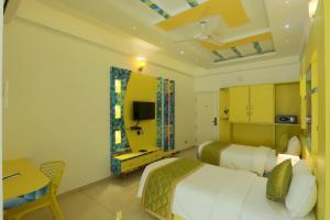 Ένα ή περισσότερα κρεβάτια σε δωμάτιο στο Premier Suites Business Hotel +9 φωτογραφίες