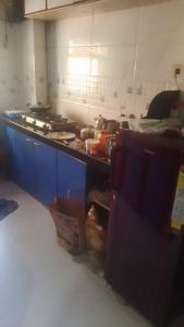 a cluttered kitchen with a counter and a counter top at Lakeside in Mumbai