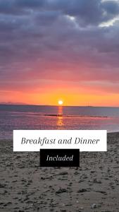 a sunset on the beach with the words breakfast and dinner included at Loa House Homestay in Lautoka