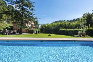 a swimming pool in the yard of a house at Villa Filippo by Mmega in Santa Lucia