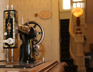 a sewing machine sitting on top of a table at Chateau Versailles in Montreal