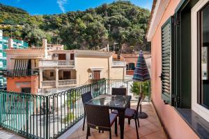 a balcony with a table and chairs and a view at Ce Tour - Casa Cetara Centro in Cetara