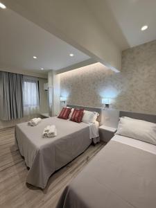 Ένα ή περισσότερα κρεβάτια σε δωμάτιο στο Ines Apartments