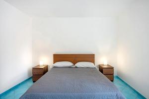 a bedroom with a bed with two night stands at Ce Tour - Casa Cetara Centro in Cetara