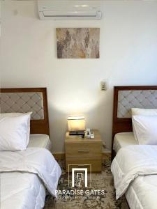 Ένα ή περισσότερα κρεβάτια σε δωμάτιο στο Paradise Gates Madinaty