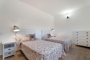 Ένα ή περισσότερα κρεβάτια σε δωμάτιο στο Casa Elvira