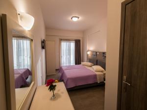 Postel nebo postele na pokoji v ubytování Harmony Hotel