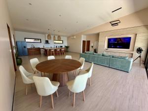 a living room with a table and a couch at Villa Sabanya Sea View in Ban Nua +15 photos