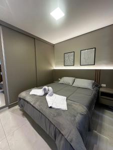 Кровать или кровати в номере Studio Aconchego Poços - Minimalista e bem localizado