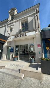 a building with a hotel sign on the front of it at Best Western Blois Château in Blois