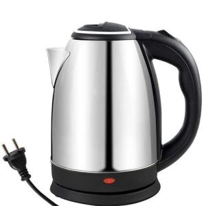 a tea kettle with a cord plugged into it at Hotel Royal King in Lucknow