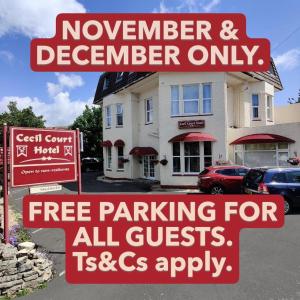 a sign for a november and decembercember only free parking for all at Cecil Court Hotel in Bournemouth