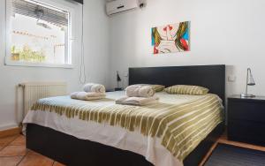 a bedroom with a bed with towels on it at Vista Hermosa in Moraira +35 photos